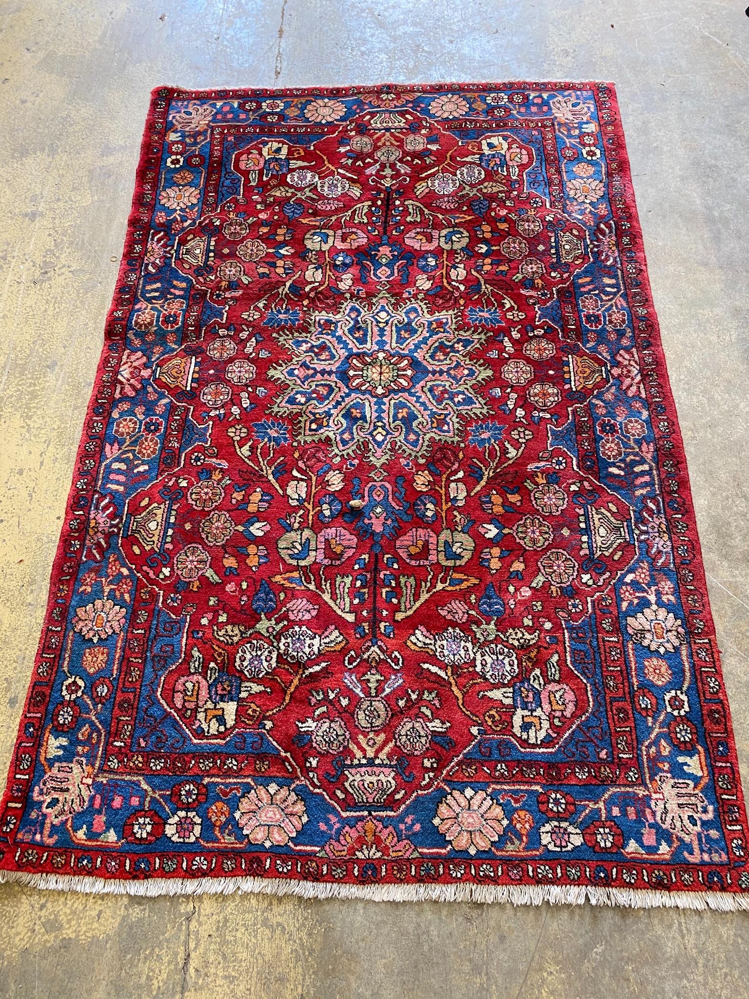 A Tabriz red ground  medallion rug